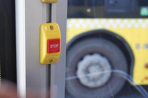 Closeup of Bus bell switch for stop inside the public bus photo