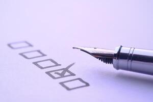 Fountain Pen and Comprehensive Checklist for Effective Task Completion and Management photo