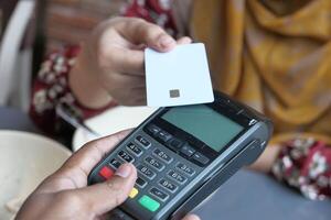 Experience the convenience of contactless payment using a card device at your local cafe photo