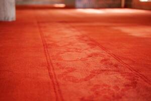 An Elegant Red Carpet Featuring Subtle Patterns Set in a Modern Interior Design Space photo