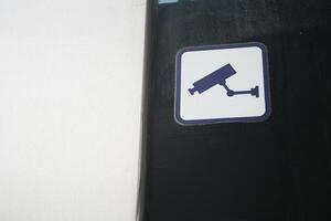 A Security Camera Icon is prominently displayed against a Dark Background for emphasis photo