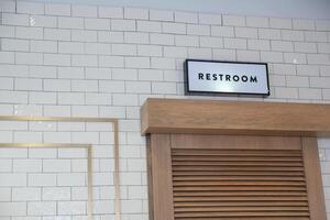 Contemporary Restroom Signage Featuring a Stylish and Sophisticated Design Aesthetic photo