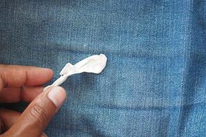 Detailed instructions for effectively removing chewing gum from fabric, with closeup view focus photo