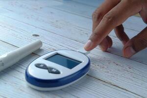 Monitoring Blood Glucose Levels Using a Portable Meter for Better Health Management and Care photo