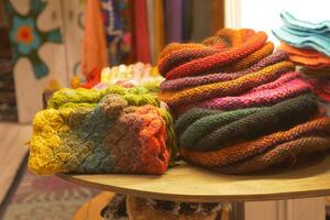 A Beautiful Array of Colorful Wool Scarves and Accessories Artistically Displayed for Everyone photo
