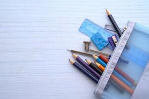 A Variety of Colorful Stationery Tools Conveniently Stored in a Transparent Pencil Case photo