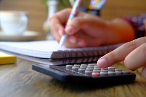 Calculating Finances Efficiently Using a Calculator and Notepad for Precision and Accuracy photo