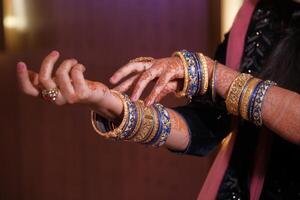 Adorn yourself with Elegant Indian Bangles that showcase Intricate Henna Design artistry photo