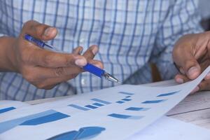 Conducting Business Analysis with Charts and Graphs in a Professional Office Environment photo