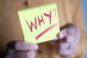 Exploring Life The Transformative Power of Asking Why Written on a Sticky Note photo