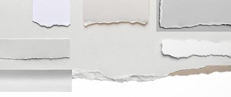 Close-up of a torn edge of white paper with rough texture, isolated on a clean white background. photo