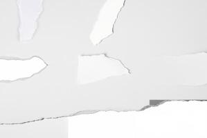 Close-up of a torn white paper edge against a clean, plain background, ideal for design or text space. photo
