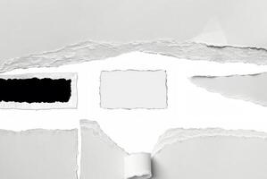 A close-up of torn paper with rough ripped edges, creating a blank white space in the center. Ideal for text insertion or creative design projects. photo