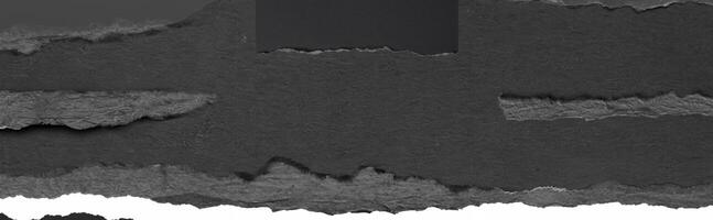 Close-up texture of torn black paper with a rough edge, perfect for background, design, or collage elements. photo