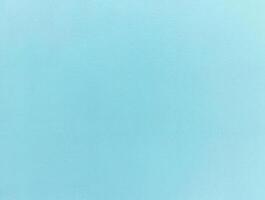 Minimalist light blue textured background with a subtle grain, ideal for design projects or as a backdrop. photo