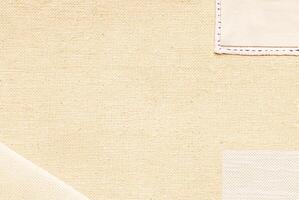 Beige fabric with visible woven texture, seamless material background, textile pattern close-up. photo