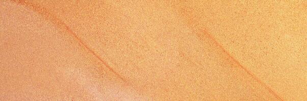 Abstract peach and gold shimmering texture background, ideal for festive designs and creative projects. photo