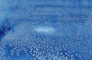 Abstract blue frost pattern resembling ice crystals, perfect for winter-themed designs, backgrounds, and creative projects. photo