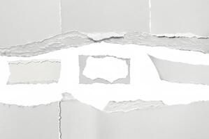 A close-up of torn paper with rough ripped edges, creating a blank white space in the center. Ideal for text insertion or creative design projects. photo
