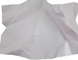 A crumpled sheet of white paper with deep folds and wrinkles, isolated on a plain white background. photo