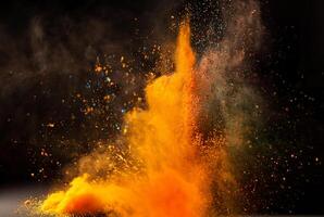Vibrant orange powder explosion with dynamic motion against a dark backdrop. photo