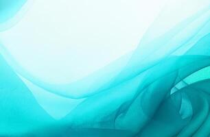 Abstract turquoise fabric texture with flowing waves and soft gradient, ideal for backgrounds or creative designs. photo