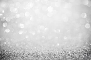 Abstract silver glitter background with defocused bokeh lights, perfect for festive or elegant designs. photo