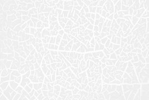 White abstract cracked texture with irregular lines forming a pattern, ideal for background or design use. photo