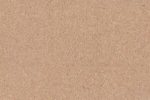 High-resolution cork board texture with a natural brown color, ideal for backgrounds and design projects. photo