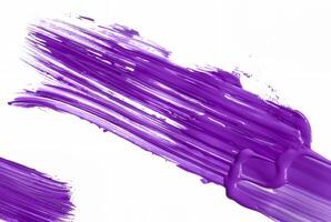 Purple paint brush stroke on white background, perfect for use in art, design, or creative projects. photo