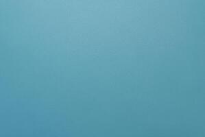 Simple minimalist blue textured background with a smooth surface, perfect for design projects. photo