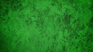 Green textured grunge background with rough and distressed surface, perfect for design, backdrop, or artistic projects. photo