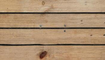 Close-up of wooden planks with dark grooves in a horizontal pattern, perfect for backgrounds, flooring, or architectural design. photo