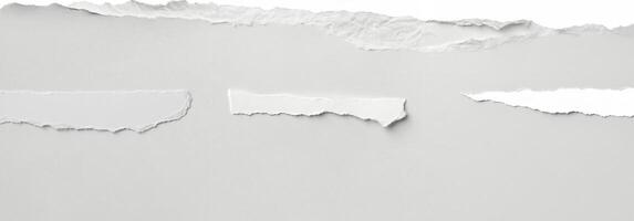 Clean torn edge of white paper against a plain background, ideal for creative, design, and crafting projects. photo