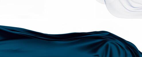 A flowing dark blue fabric elegantly draped on a white background, creating a smooth and abstract visual effect photo