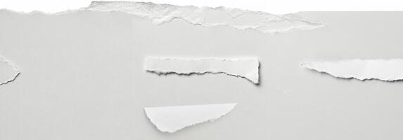 Clean torn edge of white paper against a plain background, ideal for creative, design, and crafting projects. photo