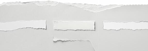 Clean torn edge of white paper against a plain background, ideal for creative, design, and crafting projects. photo