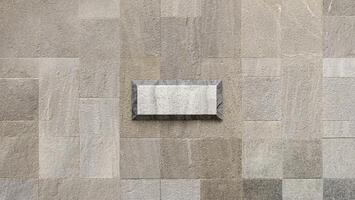 Close-up of light gray stone tile texture, ideal for use in flooring, wall surfaces, or as a background. photo
