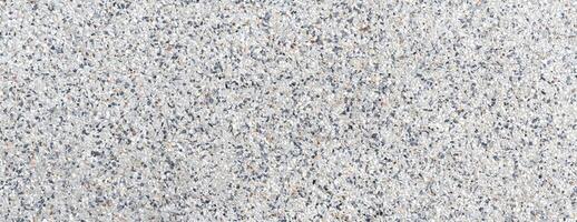 Close-up of terrazzo floor texture featuring mixed stone chips, ideal for architecture, flooring, and design projects photo