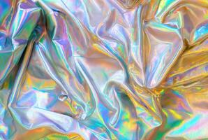 Close-up of iridescent holographic fabric with vibrant rainbow-like colors reflecting off the material, creating a futuristic and colorful texture photo