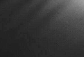 Abstract dark textured black background with a soft shadow gradient, ideal for backgrounds, designs, or overlay. photo