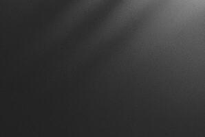 Abstract dark textured black background with a soft shadow gradient, ideal for backgrounds, designs, or overlay. photo