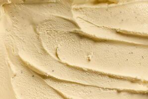 Close-up of creamy vanilla ice cream texture with smooth swirls, showcasing rich and indulgent dessert photo