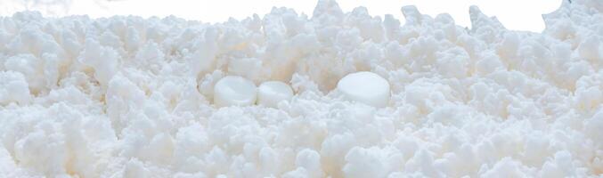 Macro shot of a fluffy white texture resembling snow or foam, ideal for winter, texture, or background design photo