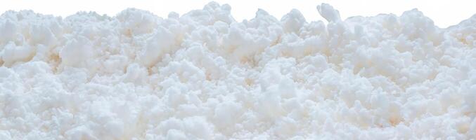 Macro shot of a fluffy white texture resembling snow or foam, ideal for winter, texture, or background design photo
