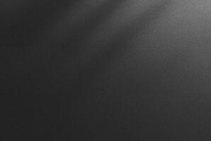Abstract dark textured black background with a soft shadow gradient, ideal for backgrounds, designs, or overlay. photo