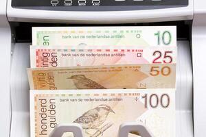 Netherlands Antillean guilder in the counting machine photo