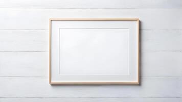 Blank beige wooden rectangle horizontal frame with white border frame inside mockup for creative design against on white wooden wall background photo
