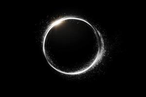 Glowing circular white frame with radiant particles on black background photo