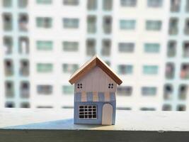 house model blurred background balcony and windows of apartment building. Finance and real estate concept. photo